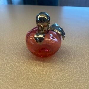 Nina Ricci / Red and Gold great to display. Empty bottle with a Little inside